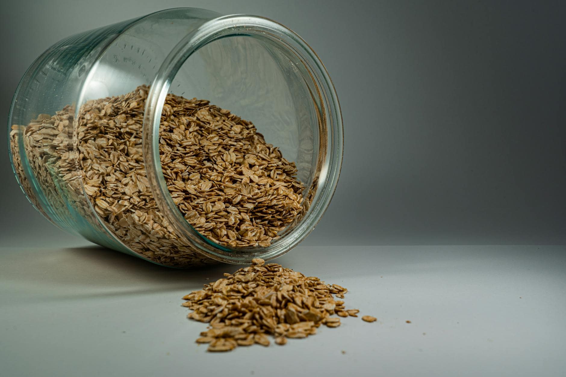 brown oats in clear glass jar