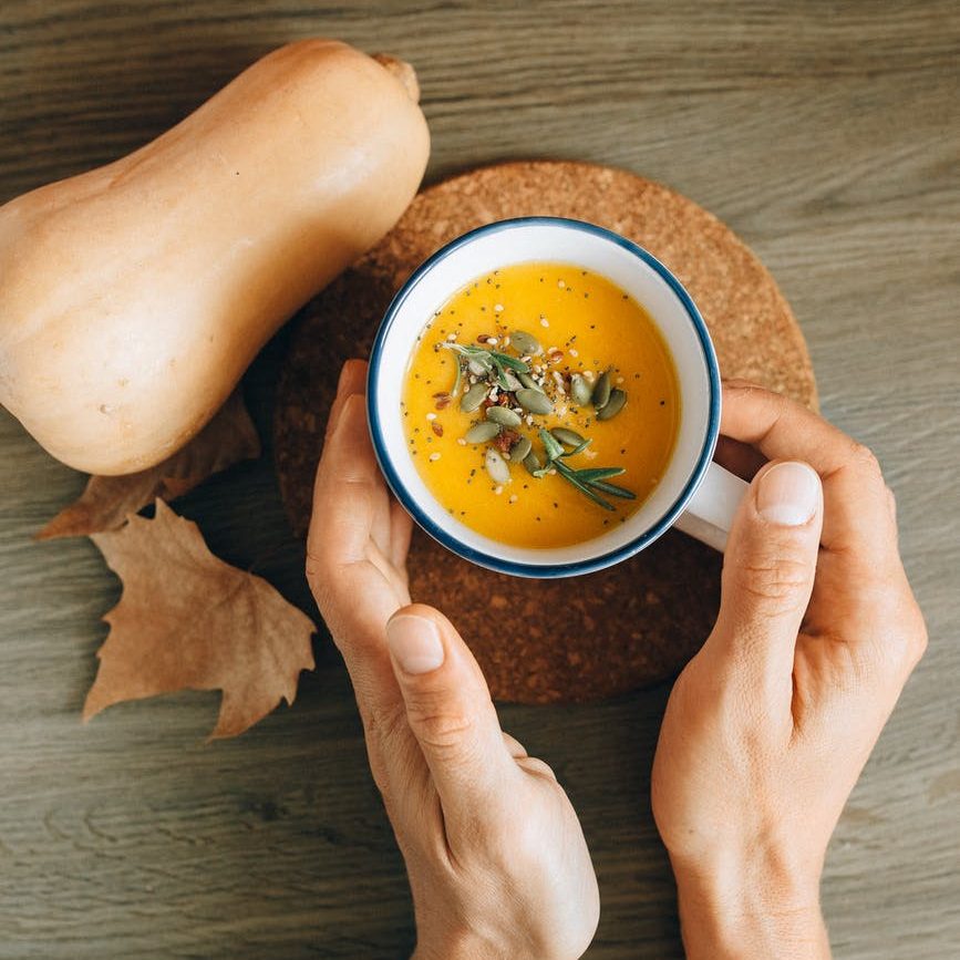 sweet potato carrot pumpkin soup with seeds and croutons