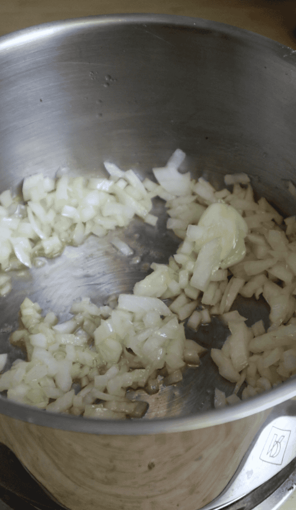 onion and garlic being sauteed