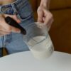 woman holding jug of milk