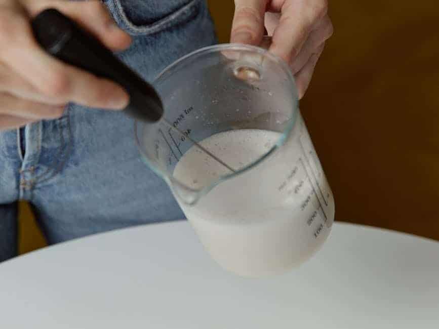 woman holding jug of milk