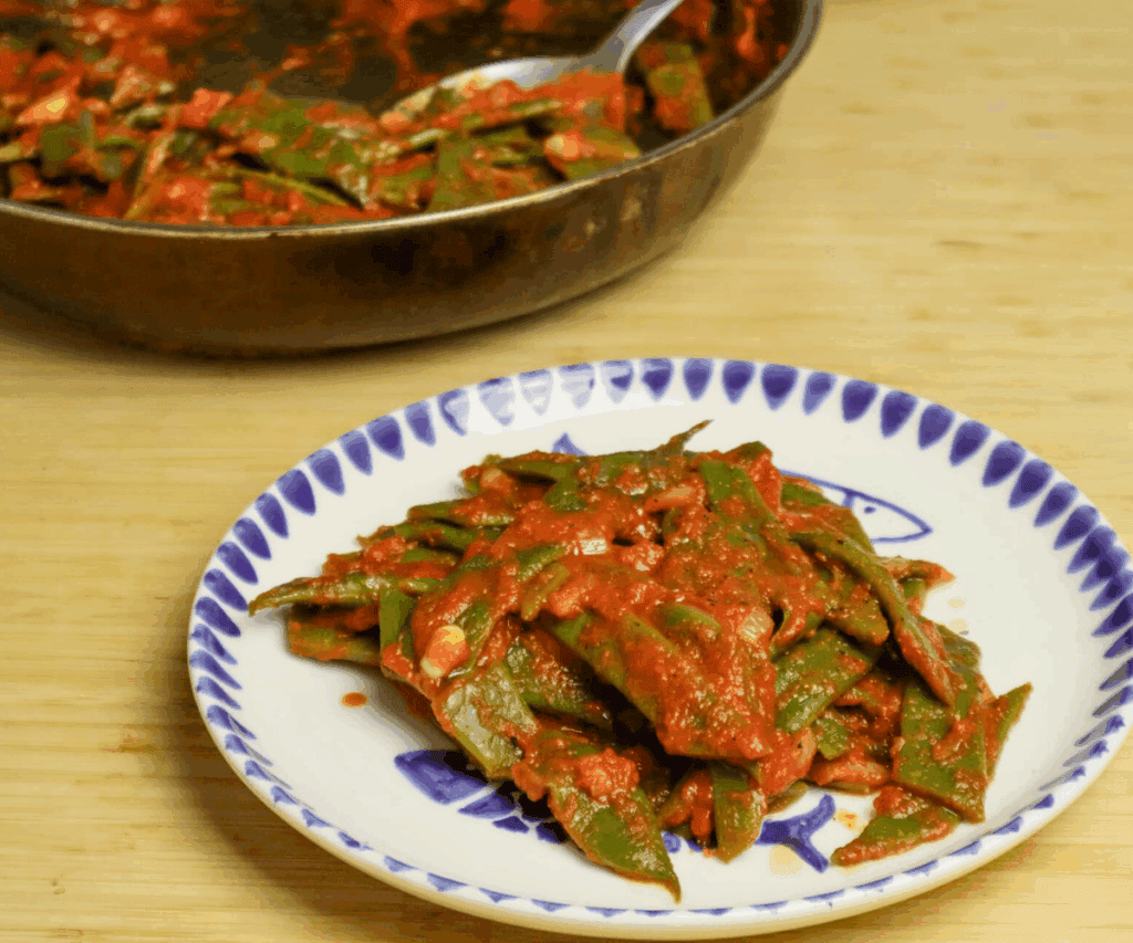 romano beans with tomato sauce plated