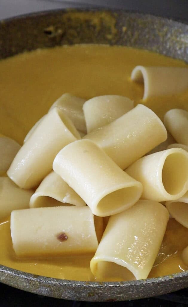 pasta mixed with carrot sauce