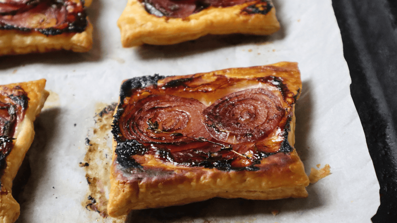 Upside Down Puff Pastry Tarts on baking sheet