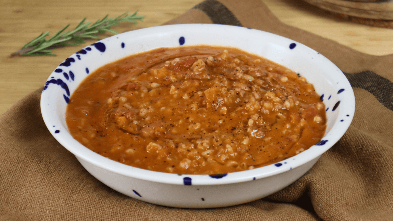 spelt soup in a bowl on top of kitchen cloth